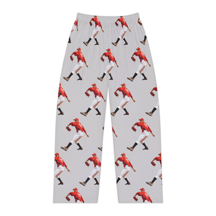 Pajama pants with a red superhero pattern on a white background