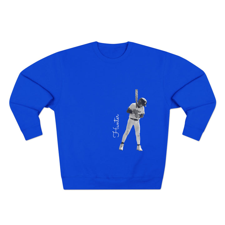 Blue sweatshirt with a graphic of a baseball player and the name &