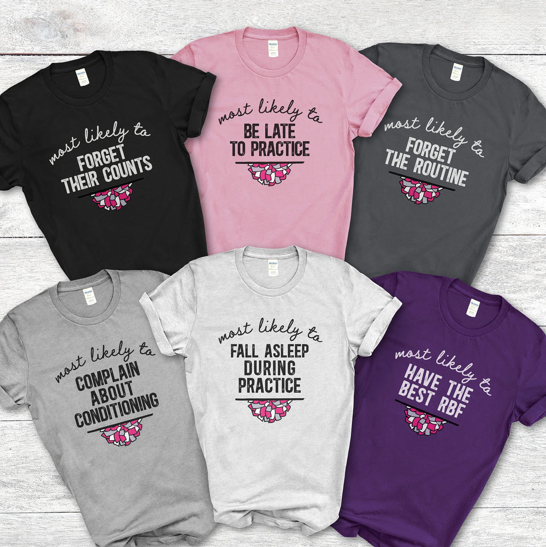 Set of cheer t-shirts with humorous text designs on a wooden surface